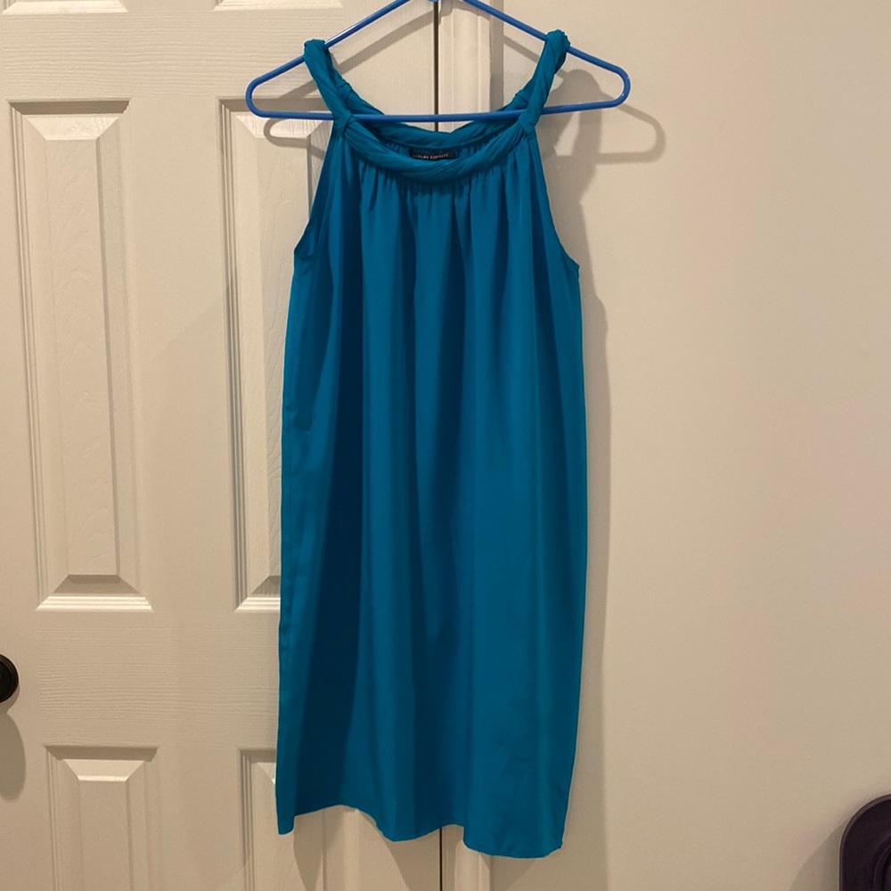 Sleeveless silk dress. The dress hits just above knee.